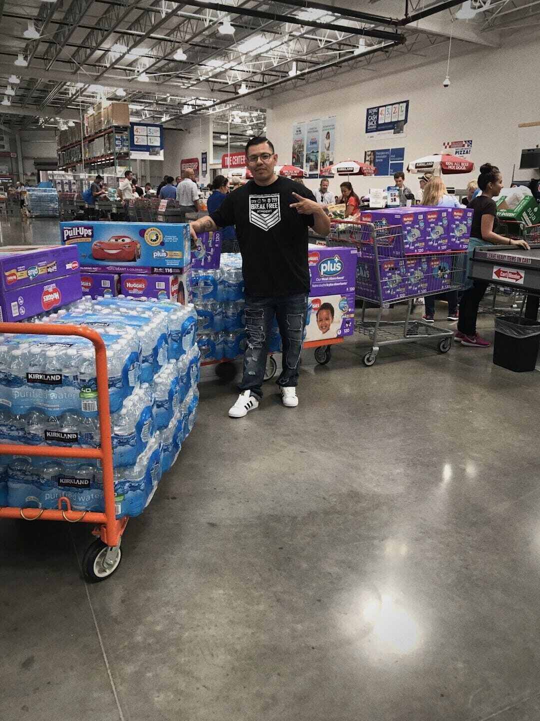 Ryan loading carts with water and supplies for storm victims