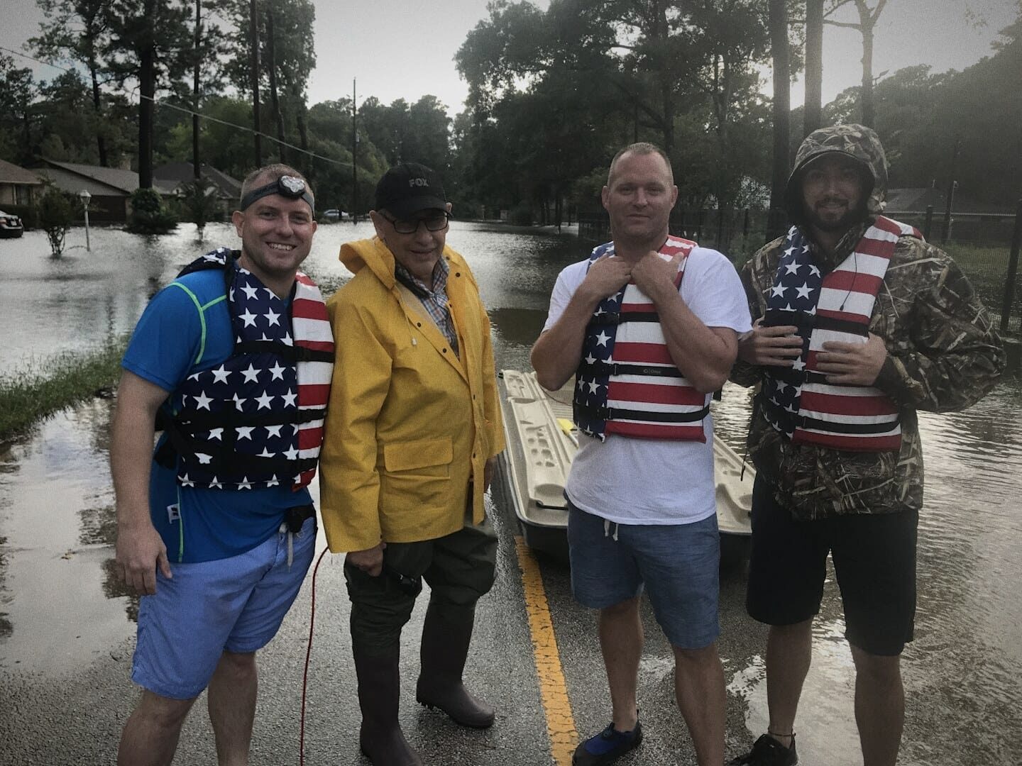 Ryan with a volunteer rescue crew in life jackets